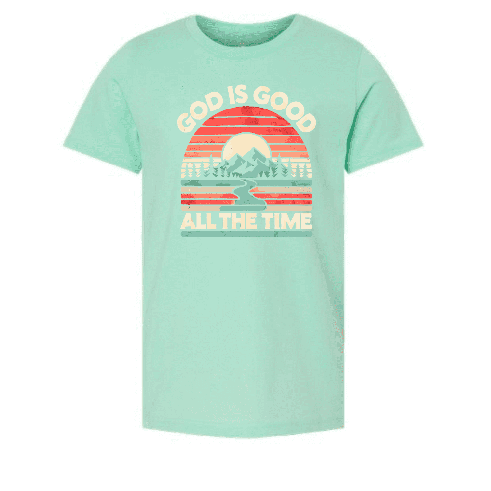 Mint green kids t-shirt with “God Is Good All The Time” and mountain sunrise design
