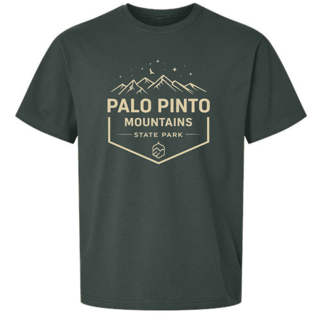 Green t-shirt featuring Palo Pinto Mountains State Park crest design with mountain peaks and stars