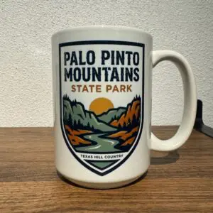 15oz ceramic coffee mug with badge-style Palo Pinto Mountains State Park design and Texas Hill Country text