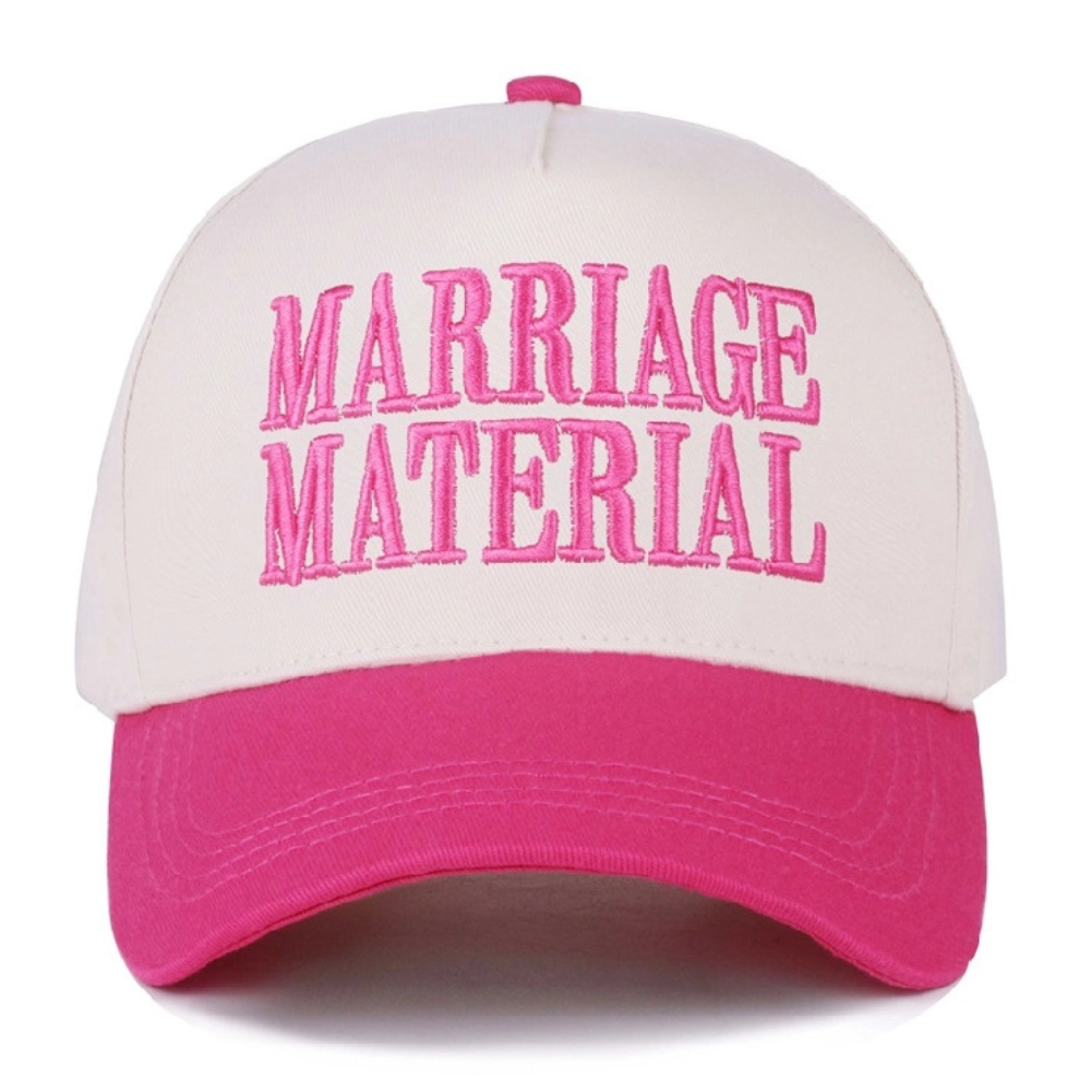 Cream and fuchsia baseball cap with bold pink embroidered “Marriage Material” text