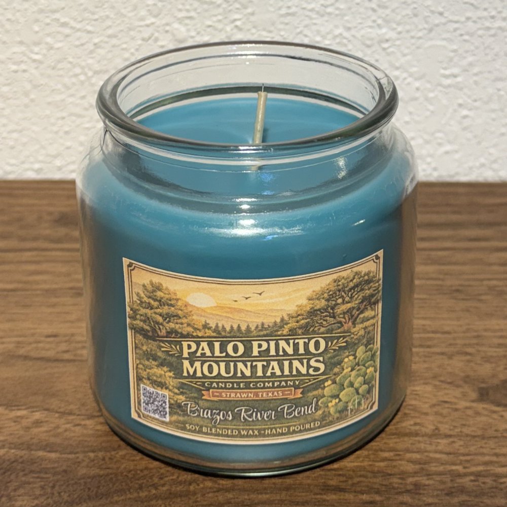 Open Brazos River Bend 16oz soy blend candle showing single wick and blue wax