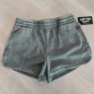 ade acid washed elastic waistband shorts with side pockets and vintage mineral wash finish