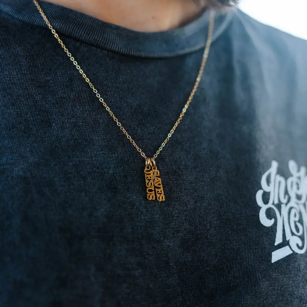 Close up of Jesus Saves stainless steel necklace pendant