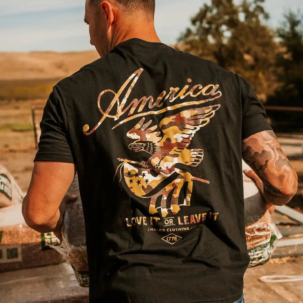 Man wearing Love It or Leave It Camo T-Shirt outdoors