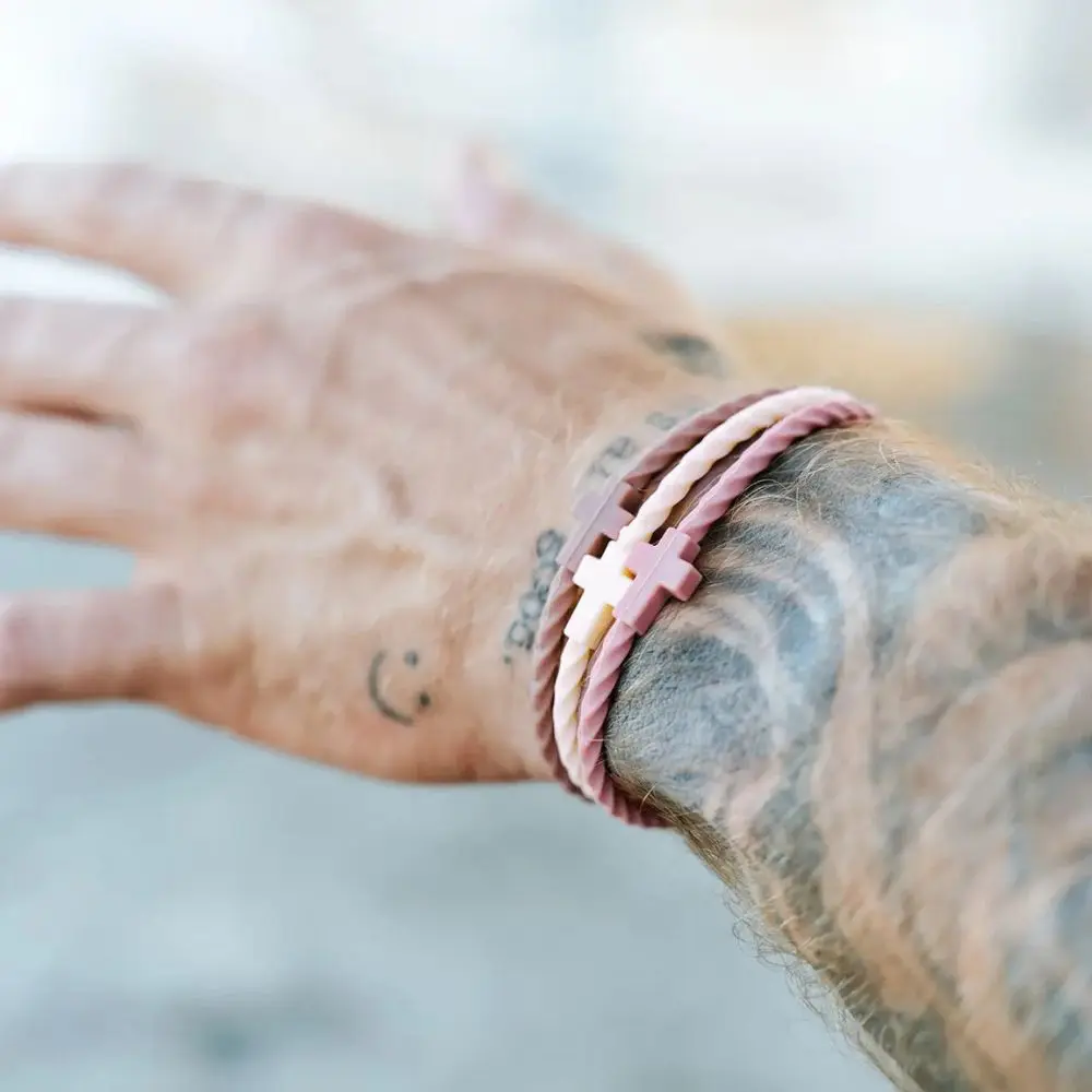 Lifestyle image of Twilight silicone bracelet set worn on guy's wrist