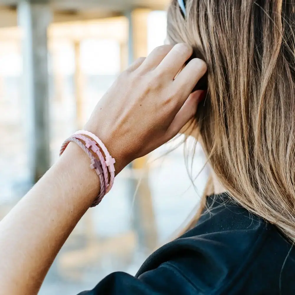 Woman wearing Twilight silicone bracelet stack by In God We Must