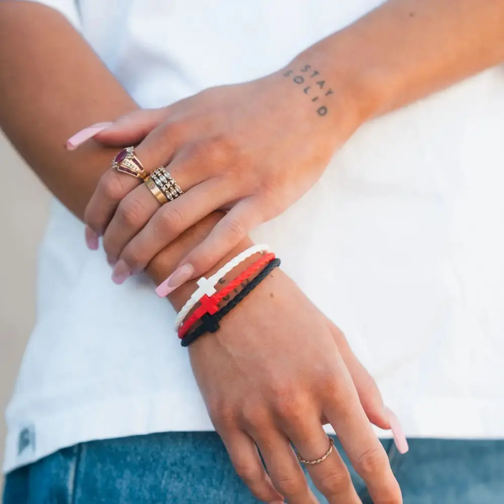 Red black and white silicone cross bracelets by In God We Must