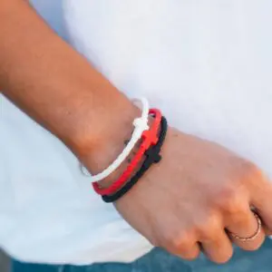 Person wearing Grace silicone bracelet set by In God We Must