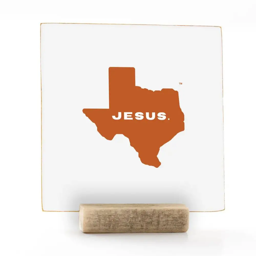 Texas Jesus wood sign in burnt orange with wooden display stand
