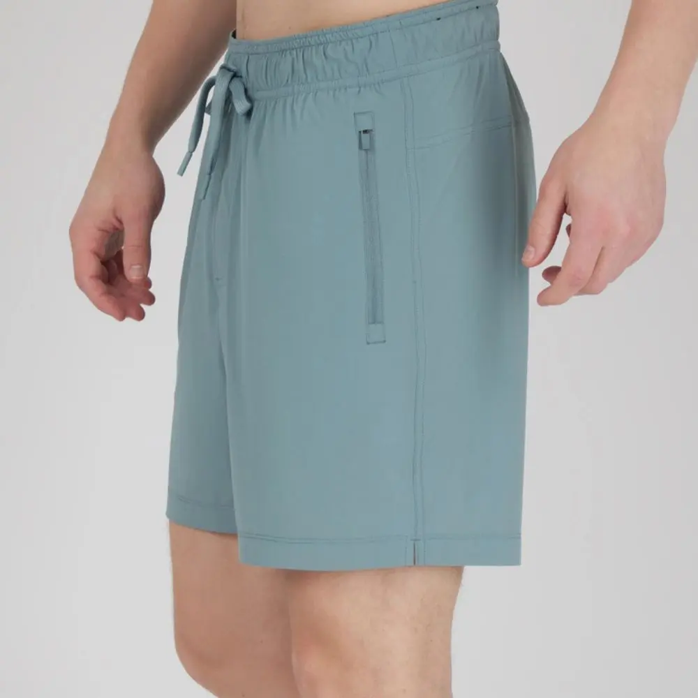 Side view of Men's Tornado stretch tech shorts showing secure zip pocket and athletic fit.