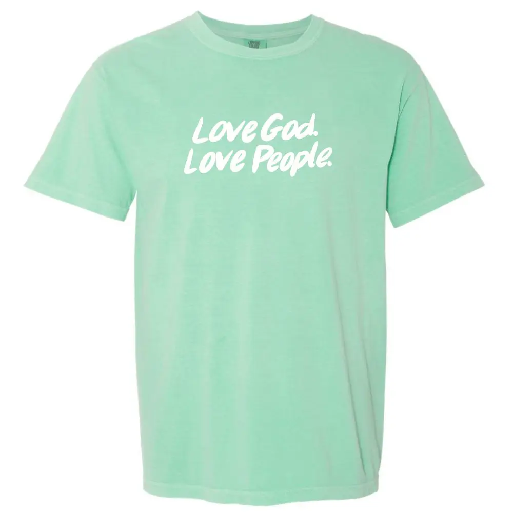 Comfort Colors Island Reef t-shirt featuring Love God Love People white script graphic.