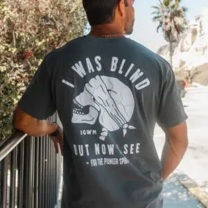 Back of charcoal mineral wash Christian t-shirt featuring the "I Was Blind But Now I See" graphic by In God We Must.