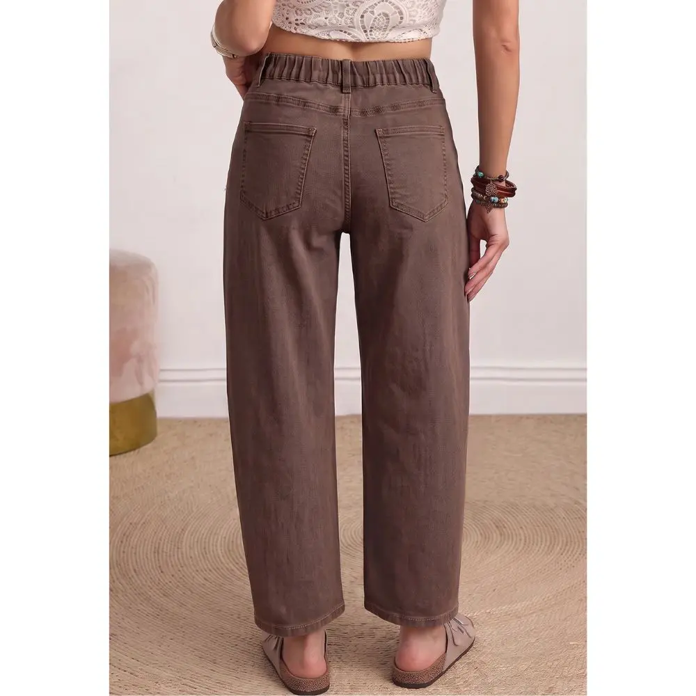 Back view of women’s brown barrel leg jeans