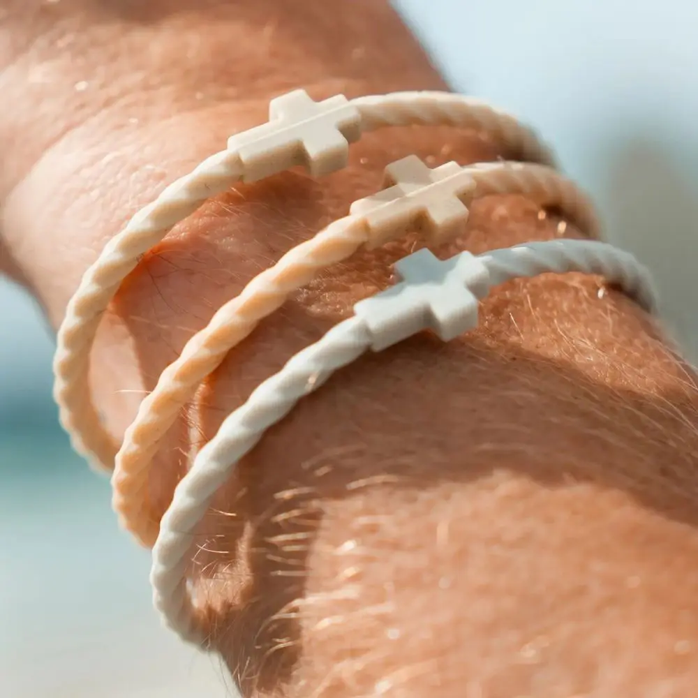 Peace Silicone Cross Bracelets stacked on wrist