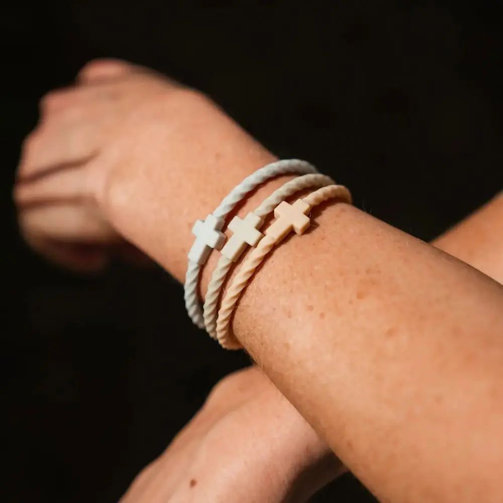 Neutral Peace Silicone Cross Bracelets worn as a stack