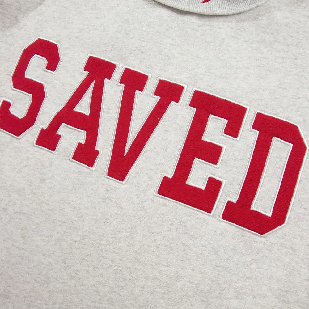 Red SAVED lettering on Saved by Grace Mock Neck Sweatshirt