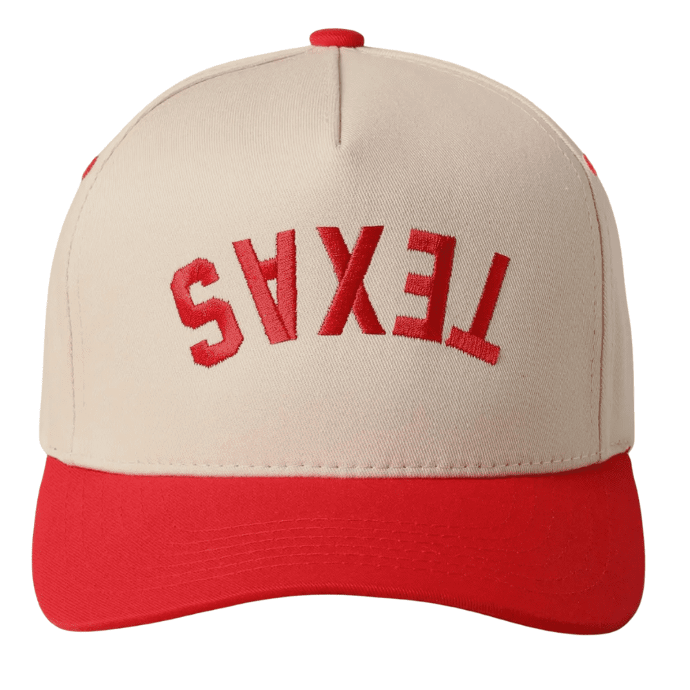 Front view of cream and red snapback with upside-down “TEXAS” embroidered in red