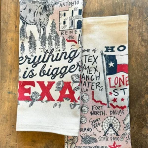 Folded kitchen towel with Texas-themed illustrations and “Everything is Bigger in Texas” text